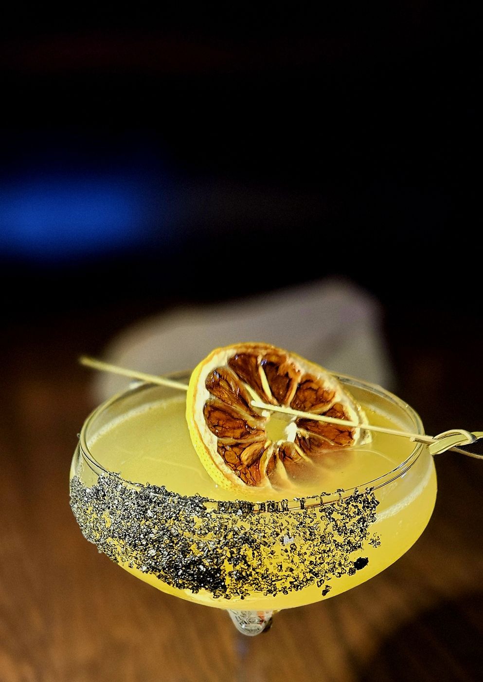 Coupe cocktail with a dehydrated citrus wheel