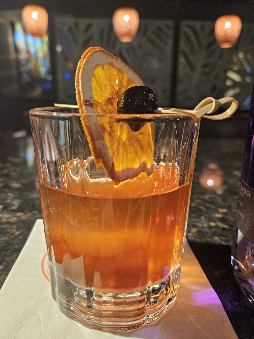 Old Fashioned with a dehydrated orange wheel and cherry